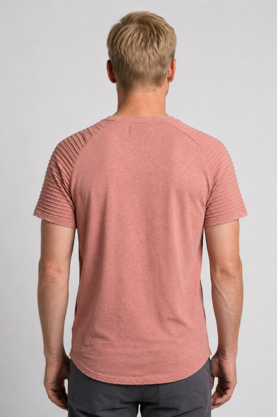 Man wearing a pink t-shirt 