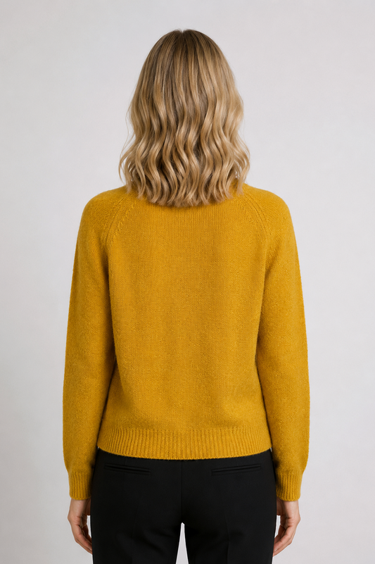 Woman wearing a mustard yellow sweater
