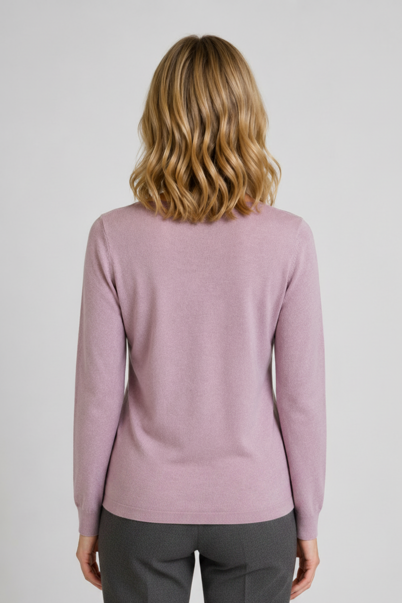 Person wearing a light purple sweater and grey trousers back view