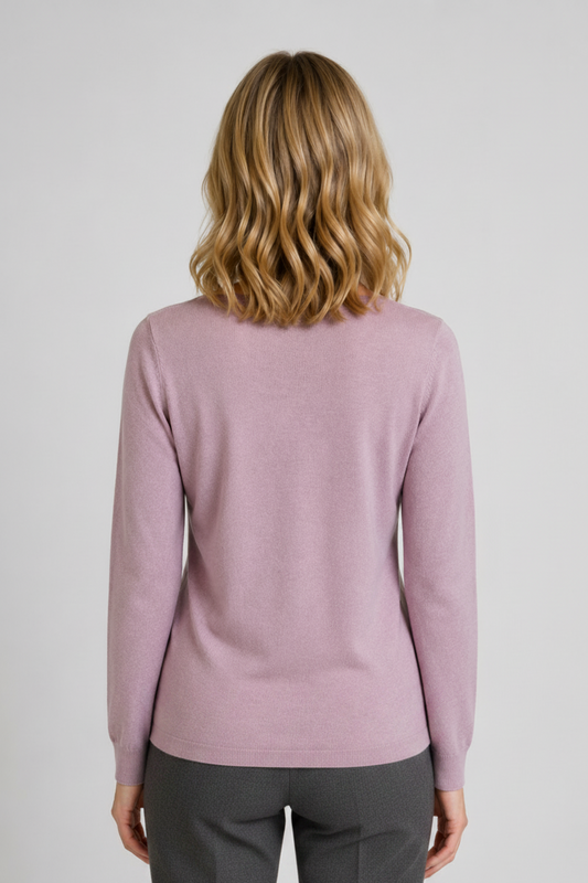 Person wearing a light purple sweater and grey trousers back view