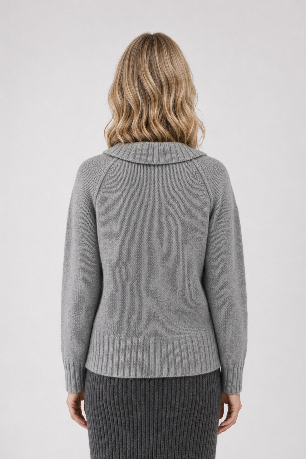 Woman wearing a grey sweater back view