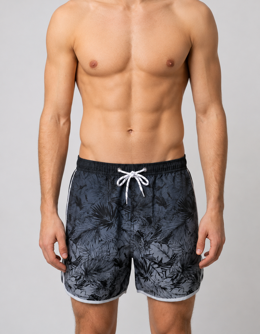 Man wearing black floral swim shorts 