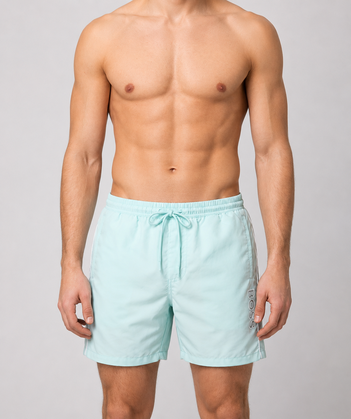 Man wearing mint green swim shorts