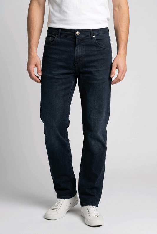 Man wearing a pair of dark navy jeans with a white t shirt