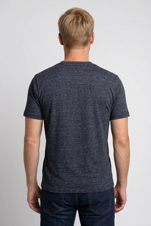 Man wearing a dark blue t-shirt and jeans 