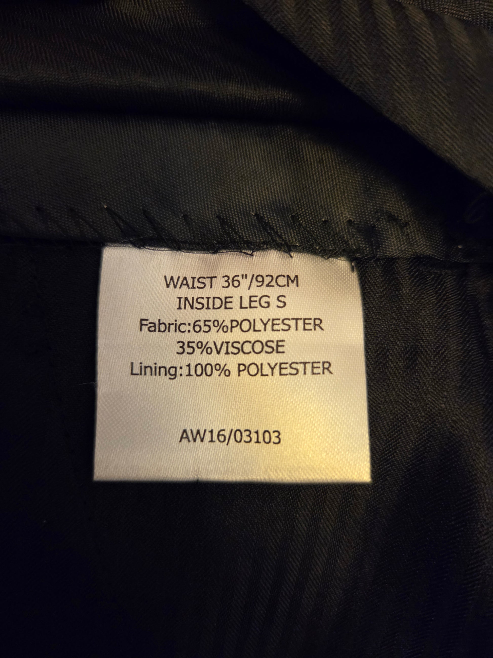 Fabric tag with size and material information on a 
