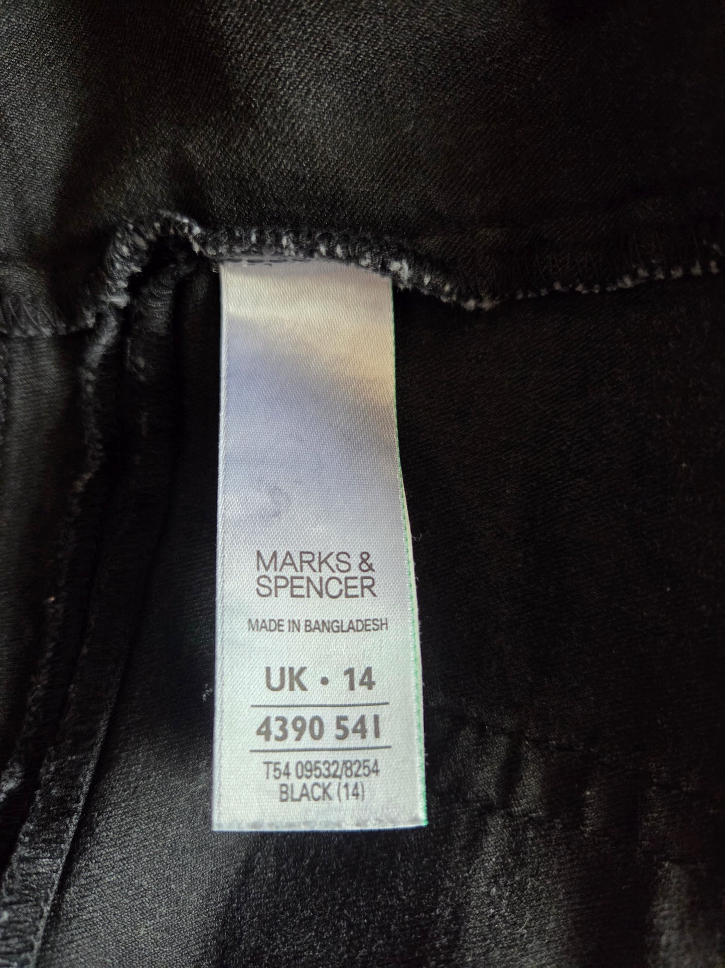 Black clothing with a Marks & Spencer label  size label