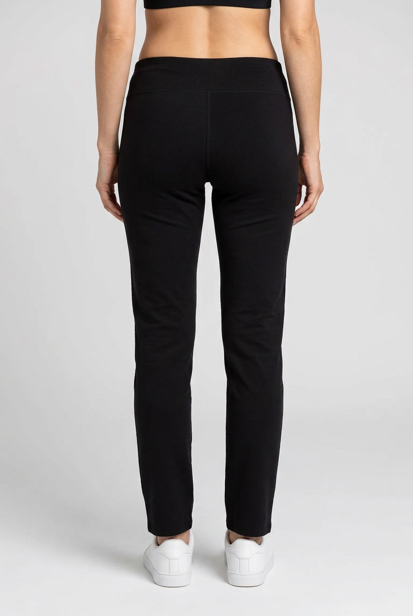 Person wearing black pants on a white background