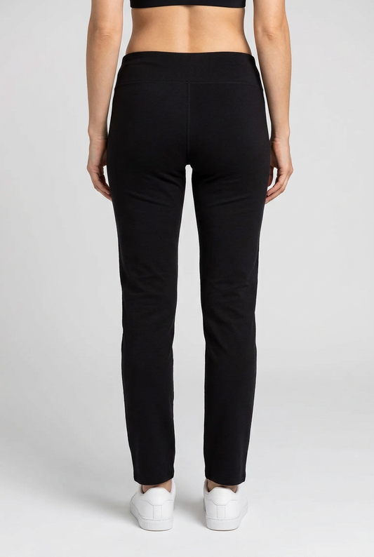 Person wearing black pants on a white background