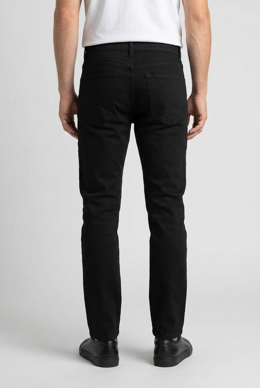 Man wearing black trousers and a white t shirt back view