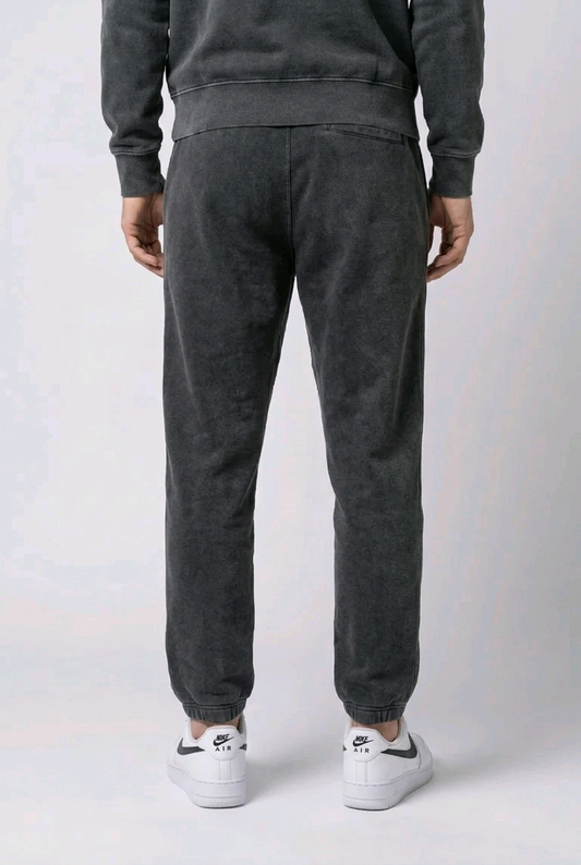 Man wearing black faded Nike joggers