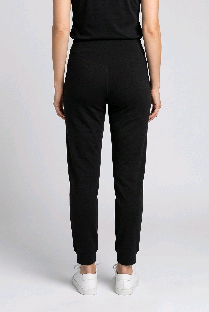 Woman wearing black Nike legging back view