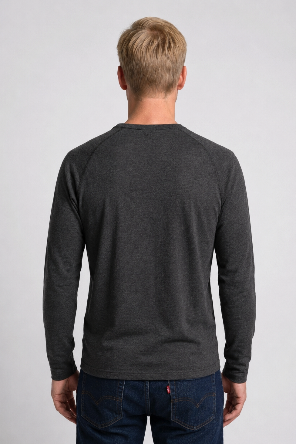 Man wearing a dark gray long-sleeve t-shirt 