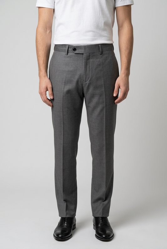 Man wearing grey trousers and a white t shirt