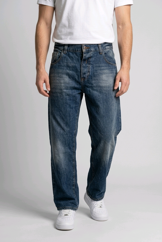 Man wearing a pair of blue jeans with a white t-shirt