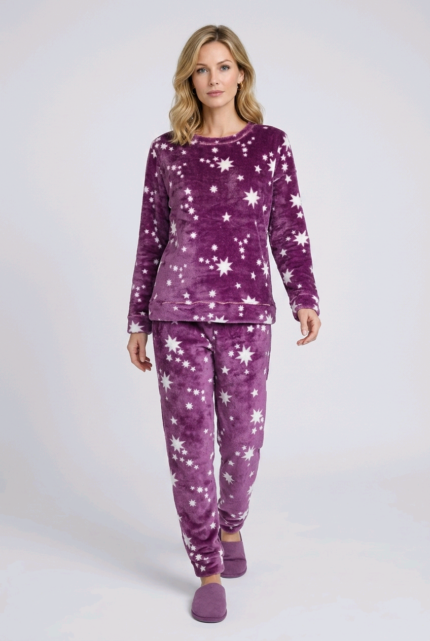 Woman wearing purple star-patterned pajamas 