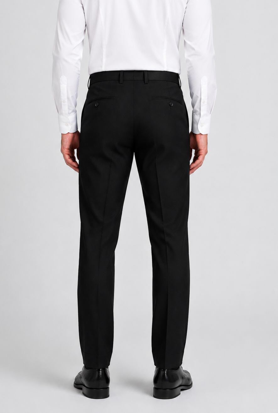 Rear view of a man wearing black trousers, a white dress shirt