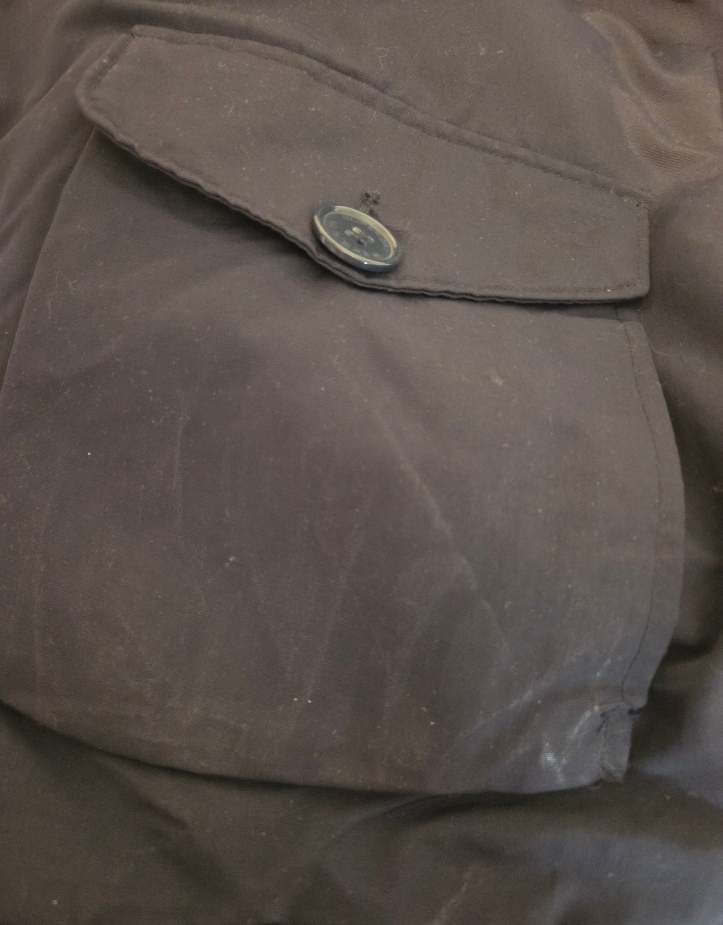 Close-up of a mark on a coat pocket