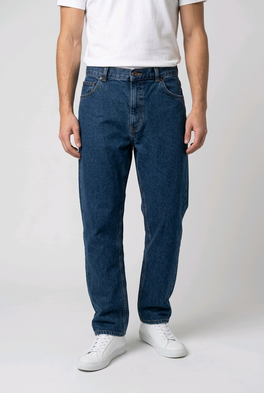 Man wearing dark denim jeans with a white t shirt