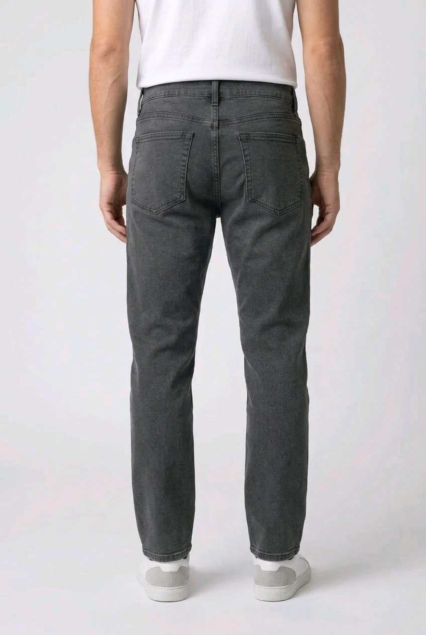 Person wearing dark gray pants on a white background