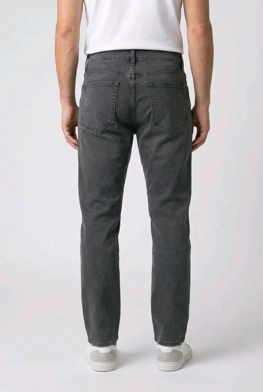 Person wearing dark gray pants on a white background