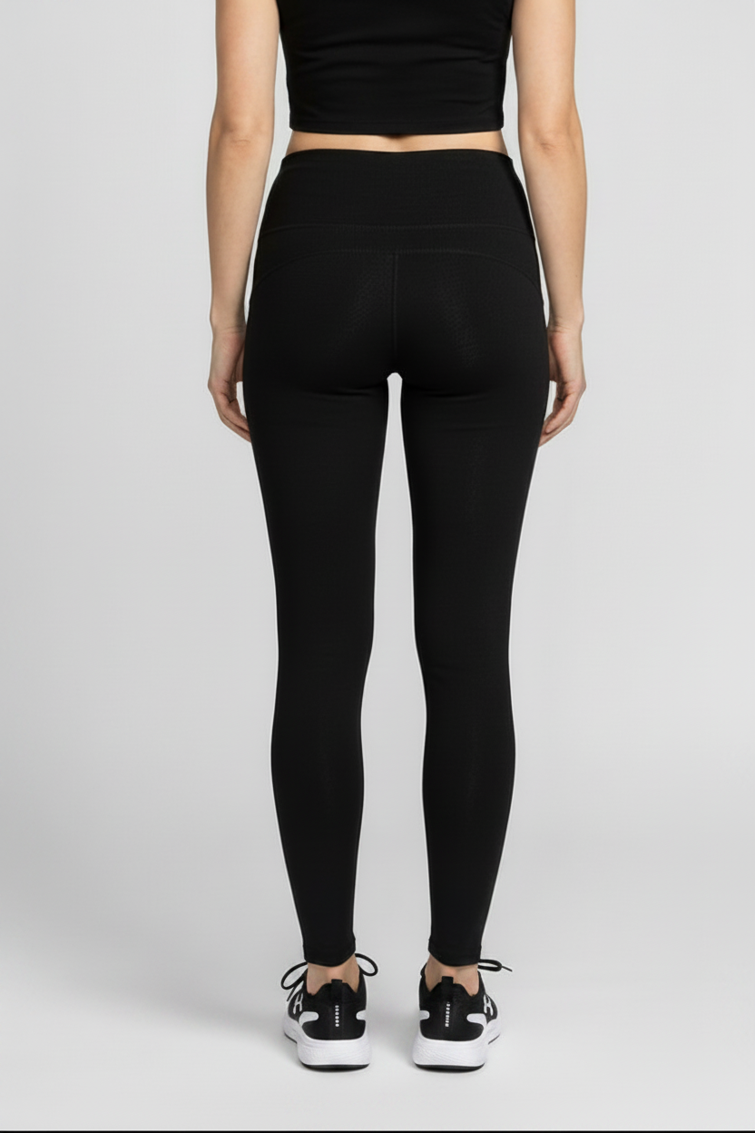 Woman wearing black leggings back view