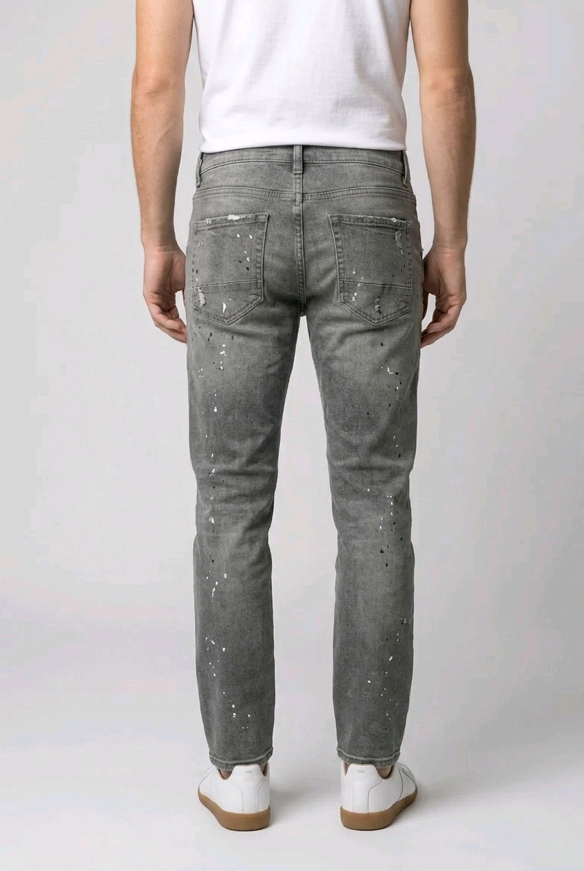 Man wearing gray jeans with white speckles 