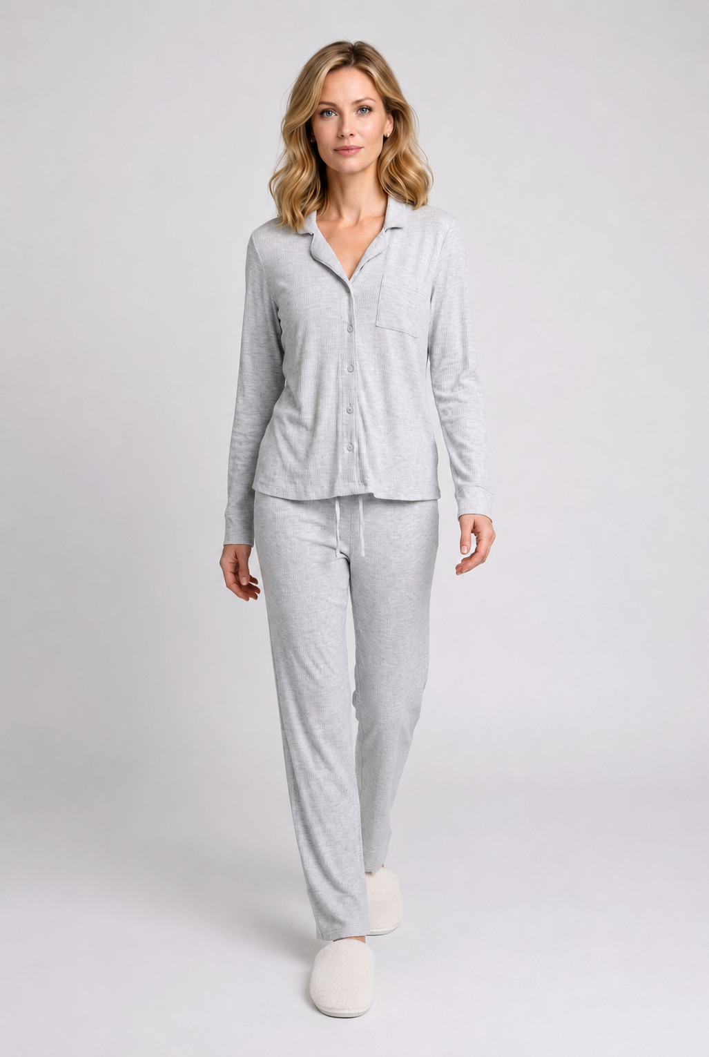 Woman wearing a light grey pajama set