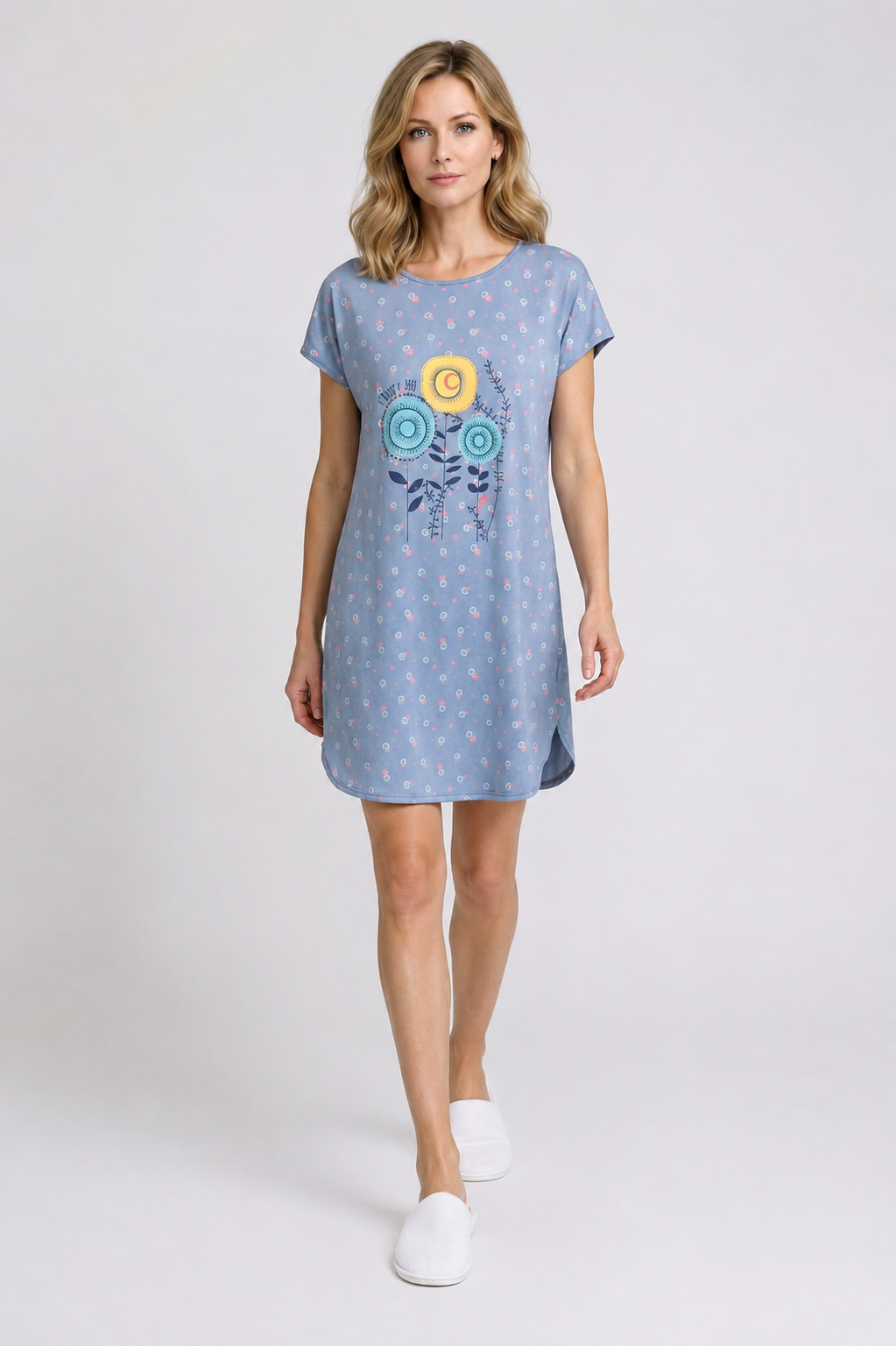 Woman wearing a blue dress with a design 