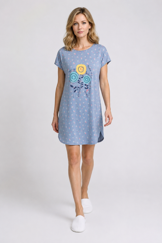 Woman wearing a blue dress with a design 
