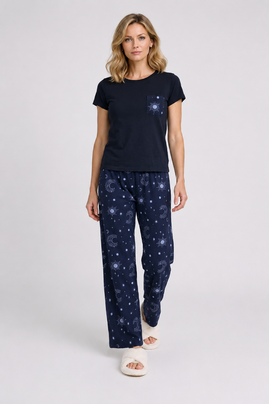Woman wearing a navy blue t-shirt and matching trousers with a celestial pattern